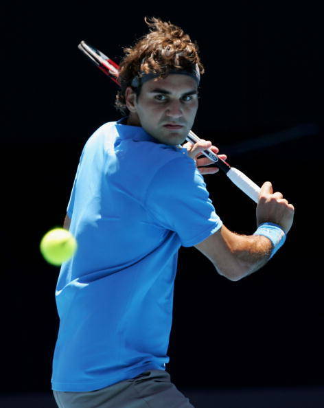 MELBOURNE, AUSTRALIA - JANUARY 17: Roger Federer of Switzerland plays a backhand during his second round match against Fabrice Santoro of France on day four of the Australian Open 2008 at Melbourne Park on January 17, 2008 in Melbourne, Australia. (Photo by Cameron Spencer/Getty Images)